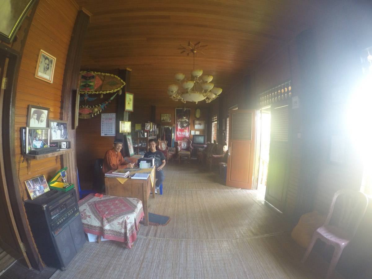 Interior of the Buya Hamka Museum displaying photographs and books by Hamka