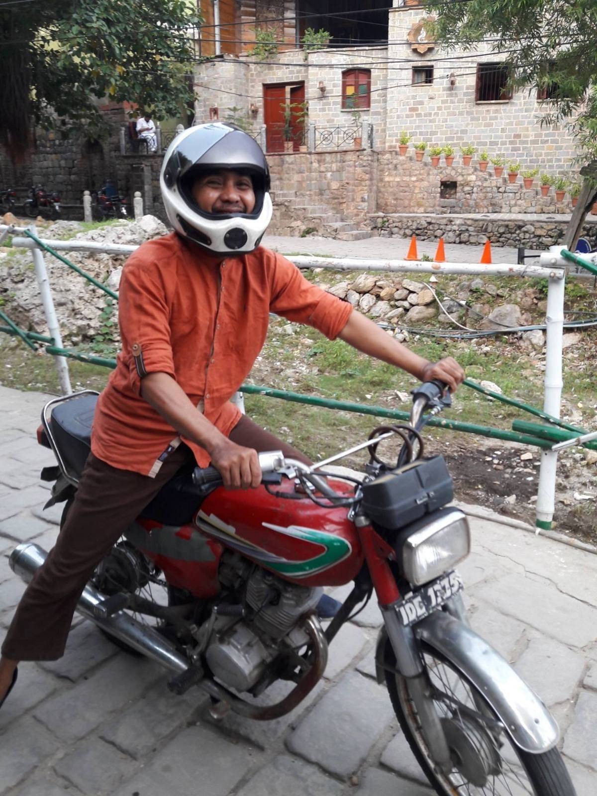 Syuaib and a typical motorcycle in Islamabad, Pakistan